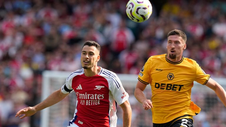 A Wolverhampton player (right) is seen with the name of a gambling company on his shirt in the team's game against Arsenal on the opening weekend of the season. Pic: AP