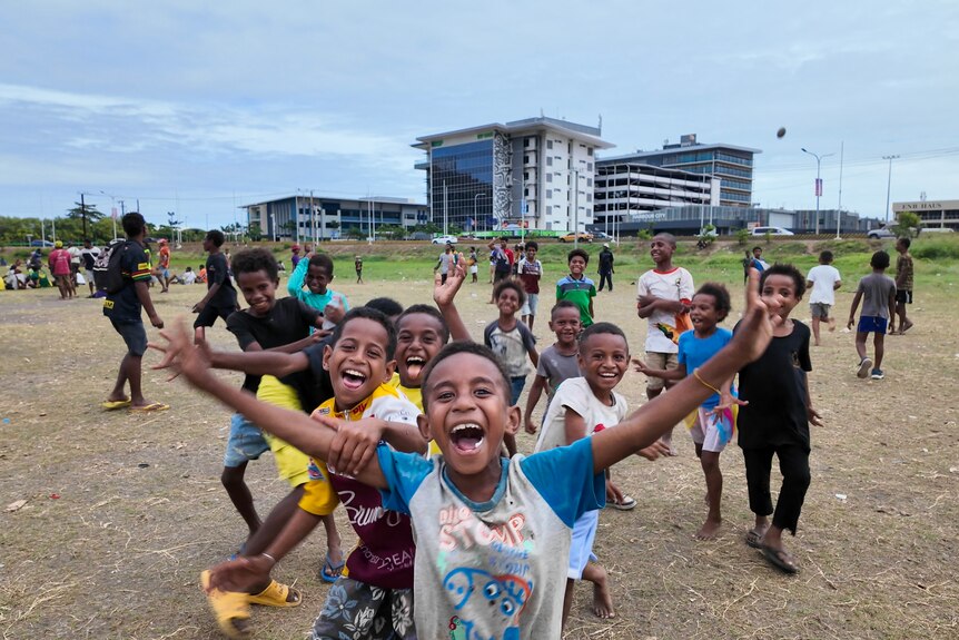 Kids at rugby game PNG