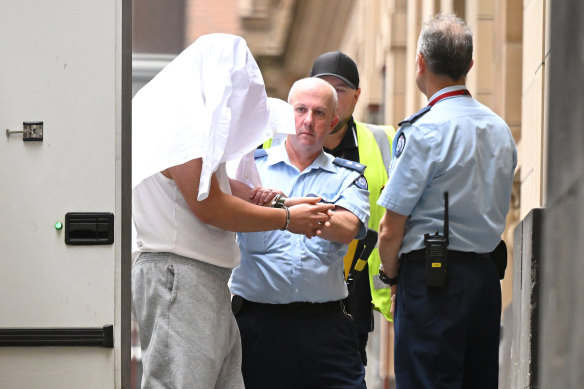 Xiaozheng Lin (left) arrives at the Supreme Court of Victoria on Monday.