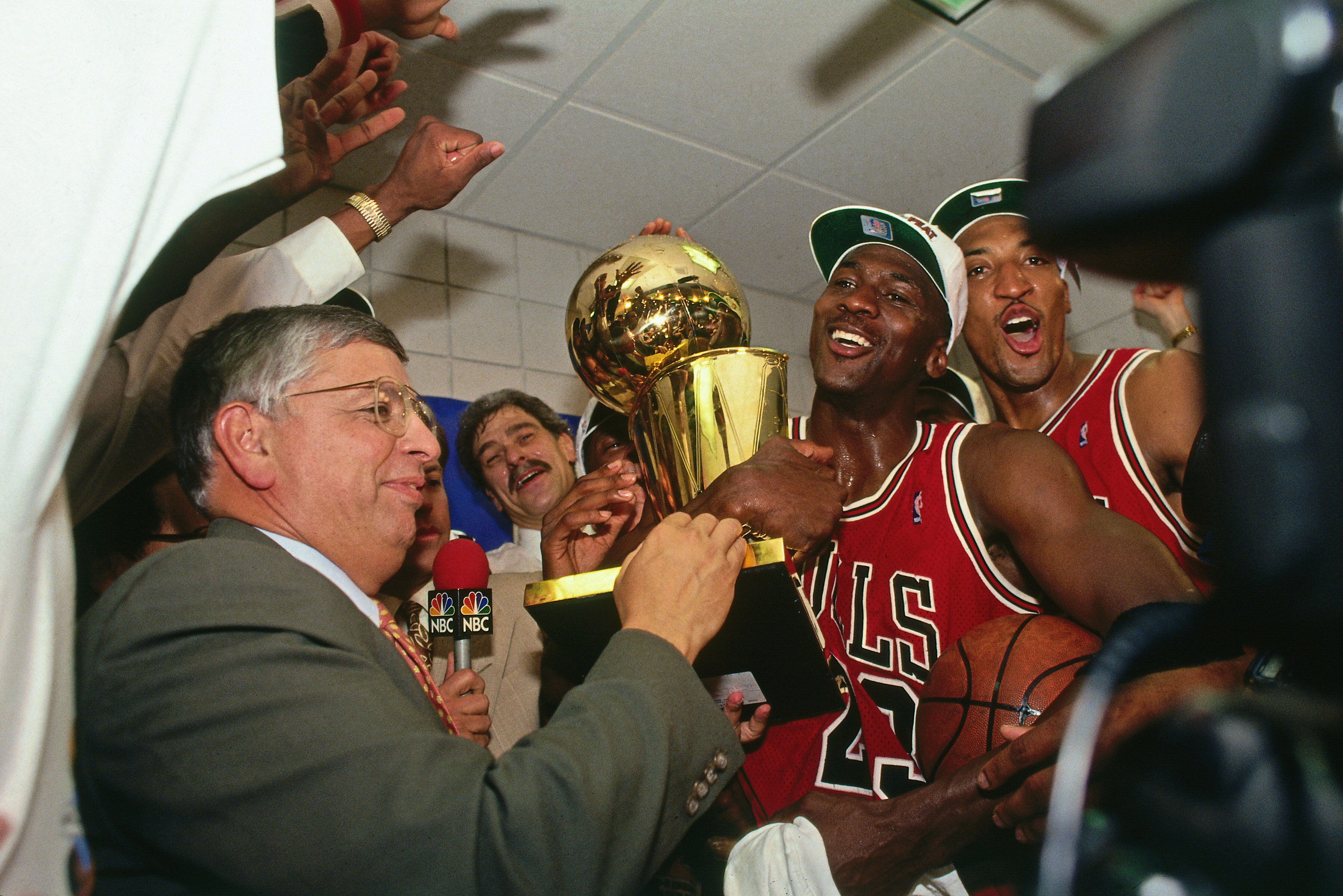 Commissioner David Stern presents Michael Jordan and the Chicago Bulls the championship trophy after the Bulls defeated the Phoenix Suns in Game Six of the 1993 NBA Finals