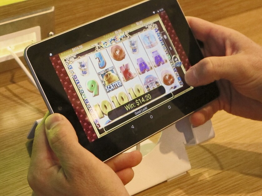 A person gambles on a tablet in New Jersey in this 2015 file photo. 