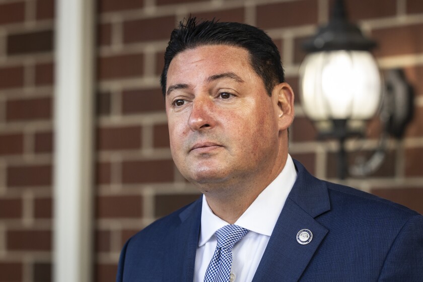 State Rep. John Cabello, R-Machesney Park, pictured at a July news conference outside Milwaukee. 