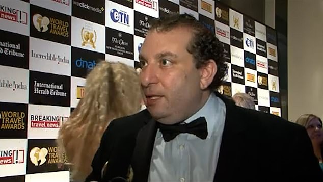 Lester is pictured at the 2012 World Travel Awards in India after his firm won an accolade